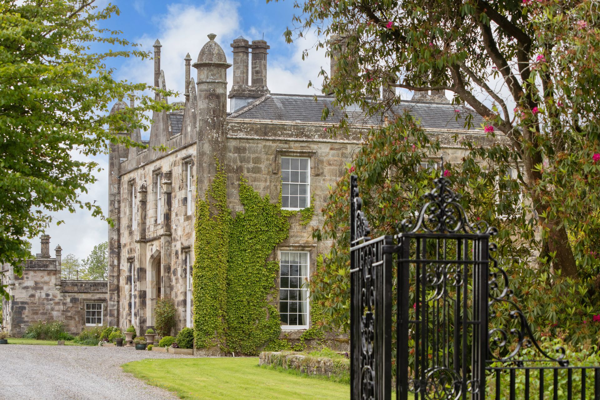 View of Fortwilliam House from beyond iron gates