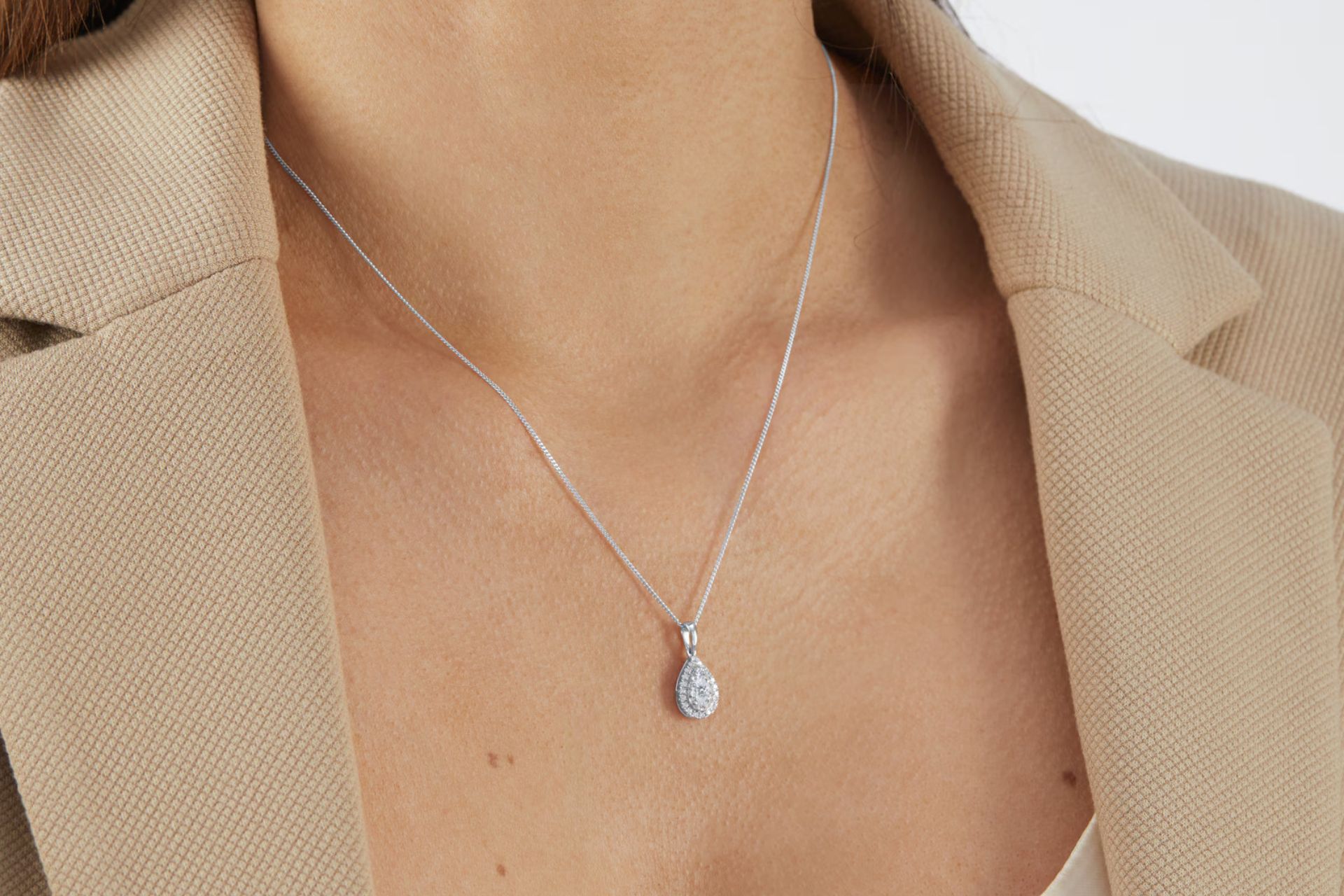 Model wearing diamond necklace and 