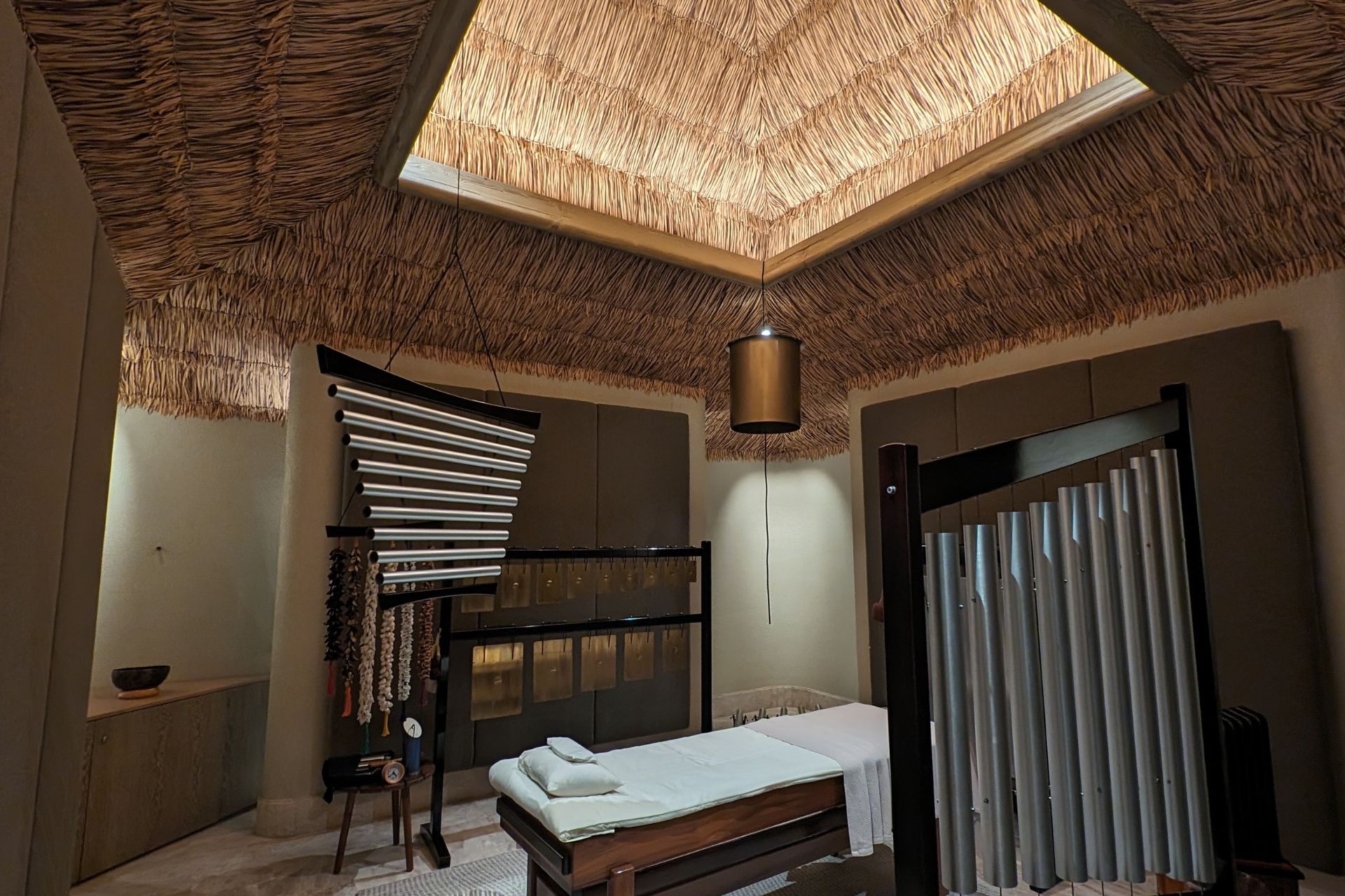 Spa treatment room with a thatched roof