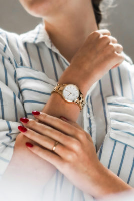 Woman in smart casual shirt and watch