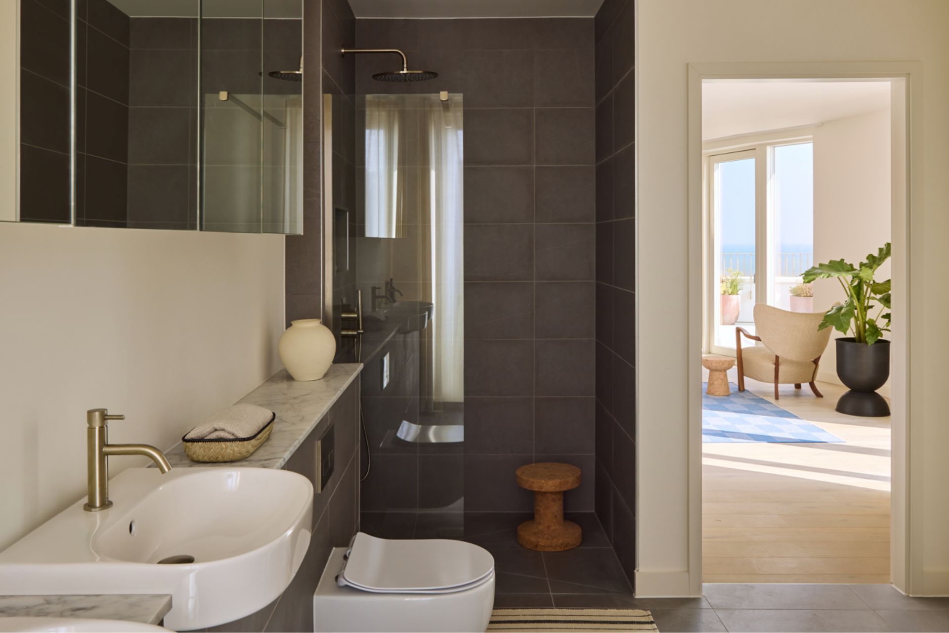 Ensuite bathroom with grey tiles.