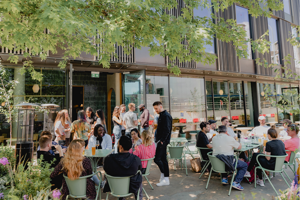 People outside a modern London pub