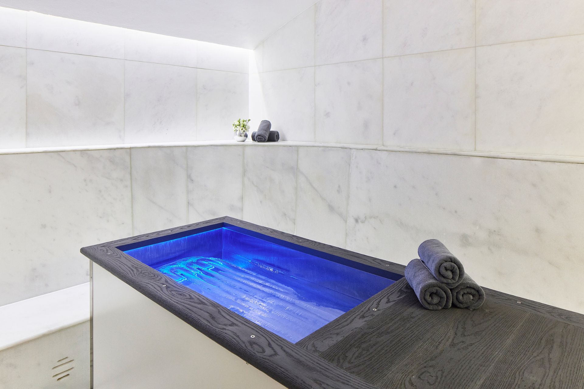 Cold water plunge pool in a marble treatment room