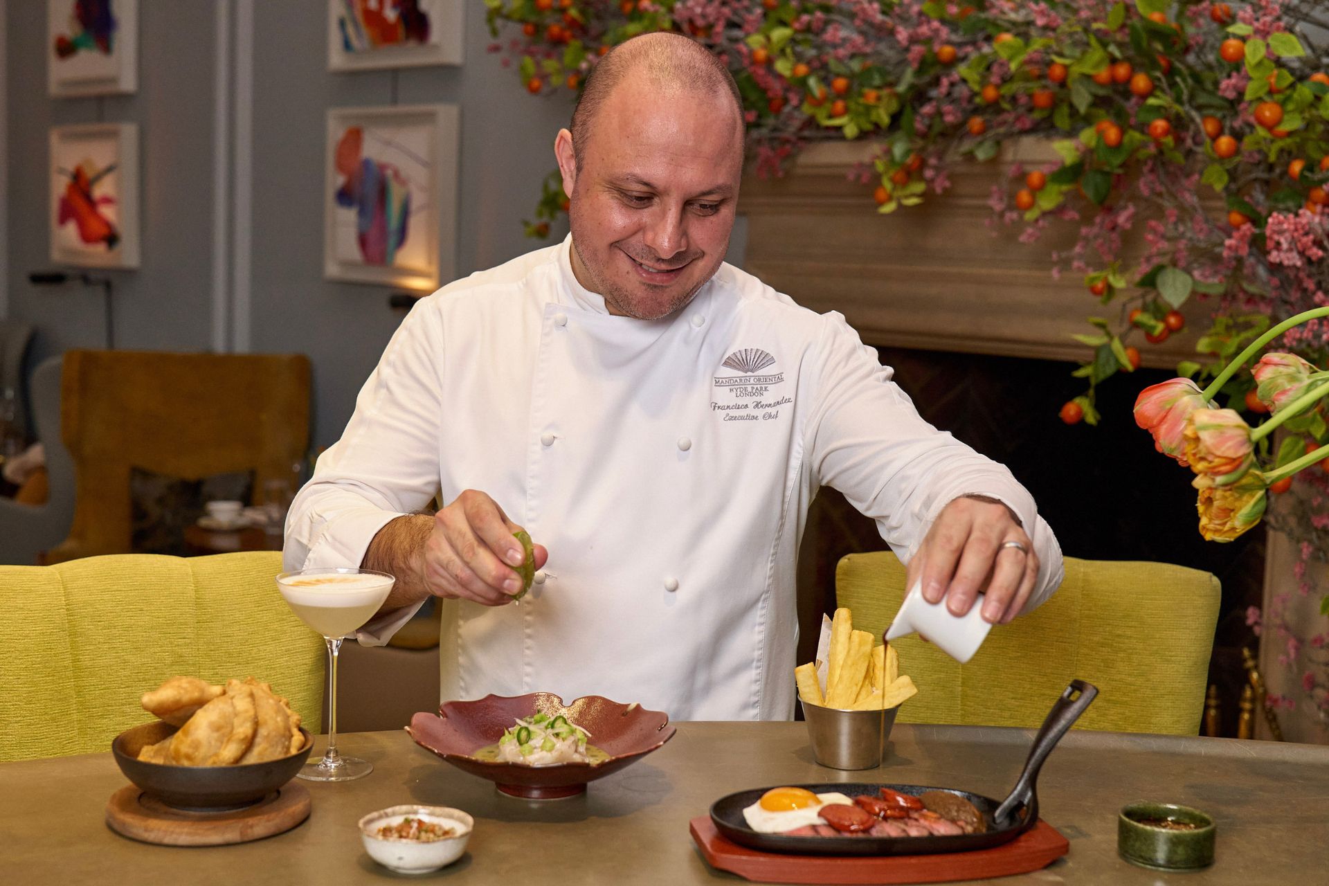 Lucho's head chef, Francisco. preparing dishes in the dining room.