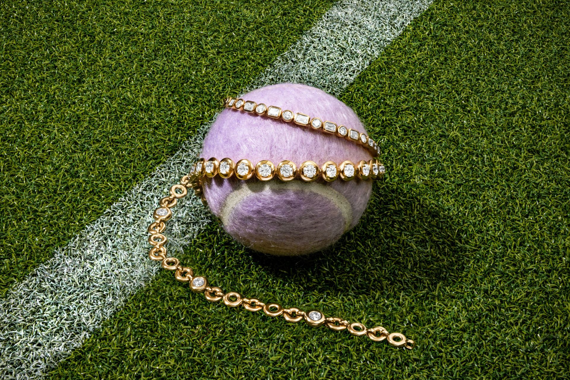 Purple tennis ball with a Pragnell tennis bracelet wrapped around it.