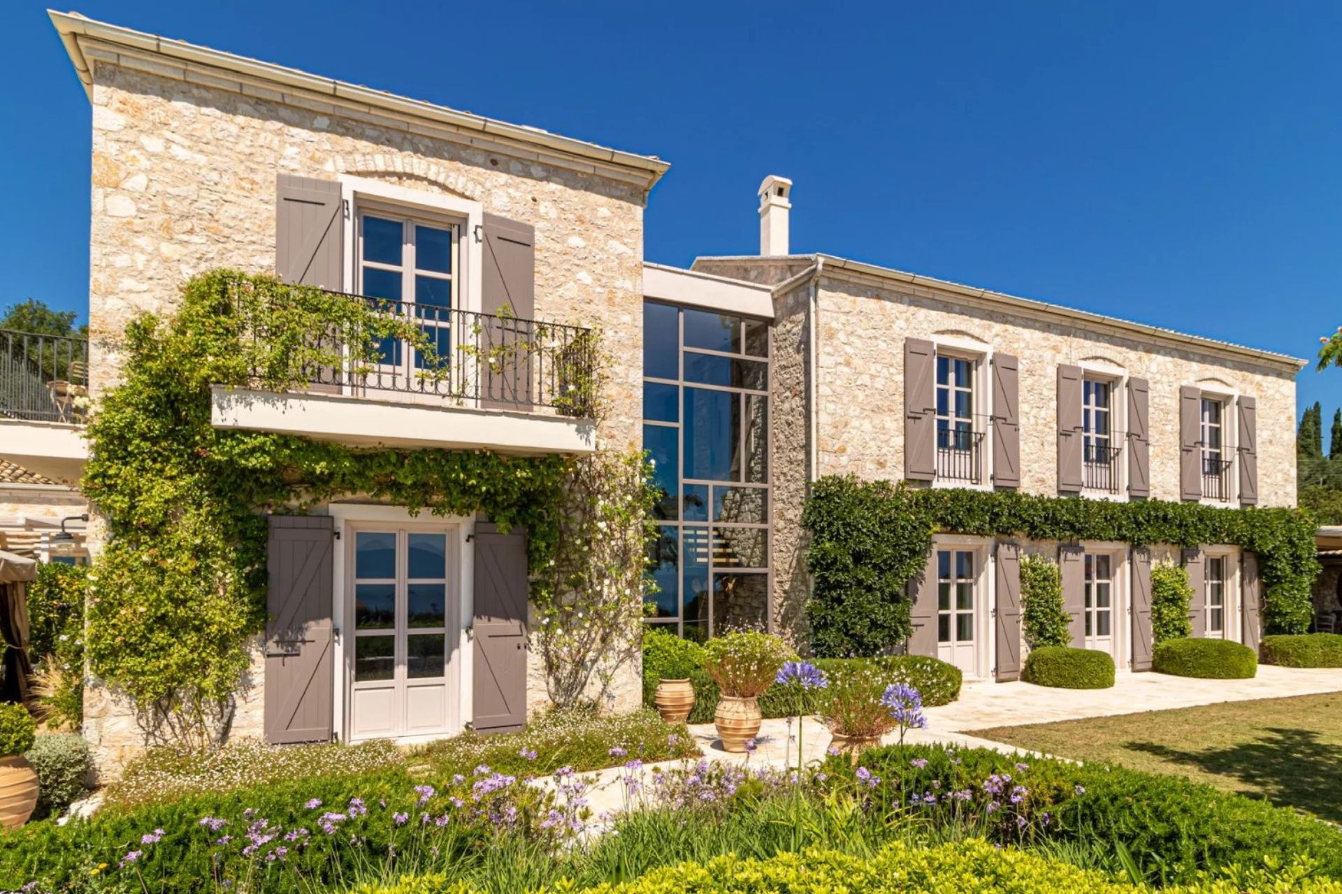Front view of Villa Koukus, with landscaped gardens