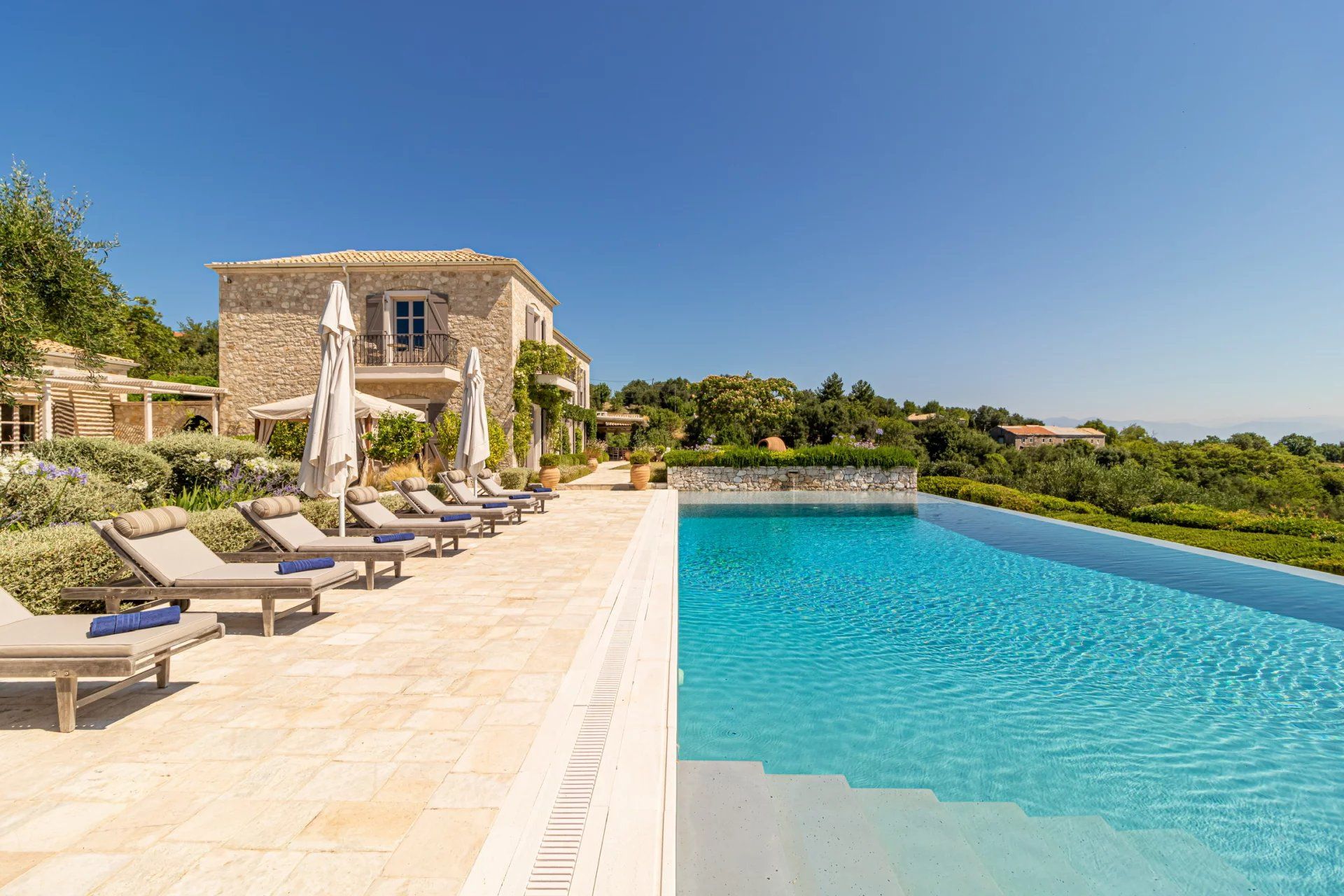 Outdoor pool with hillside views