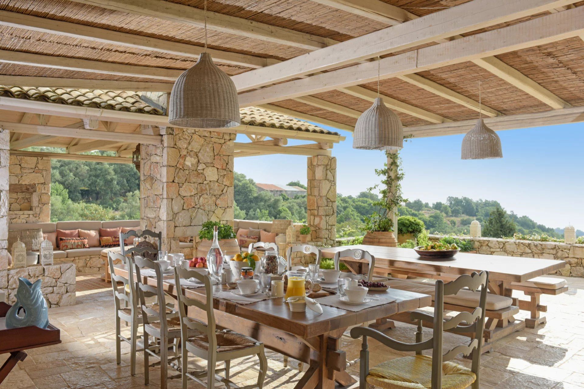 Outdoor dining area with views over the Greek hills