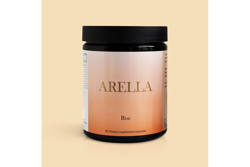 Supplement bottle on orange background