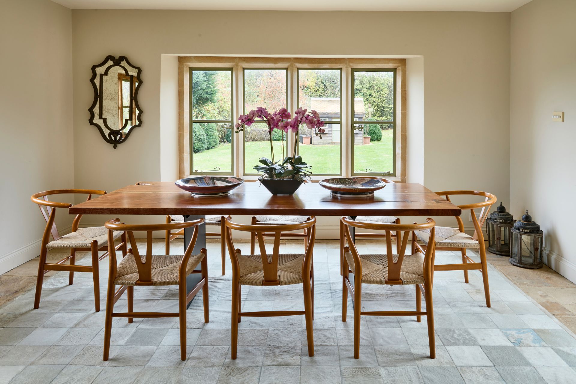 Dining room with wooden furniture and garden views