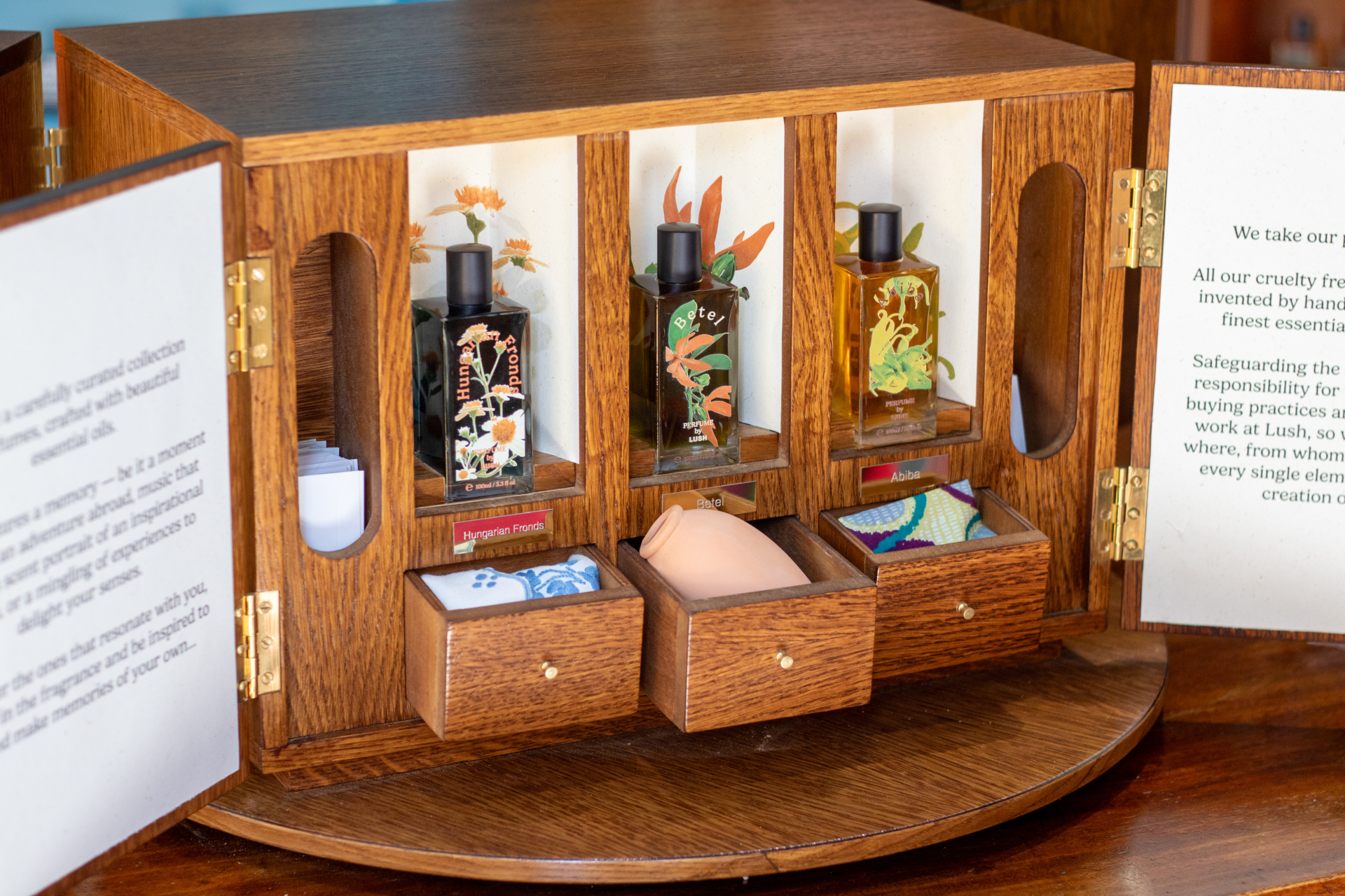 Wooden cabinet with perfume bottles