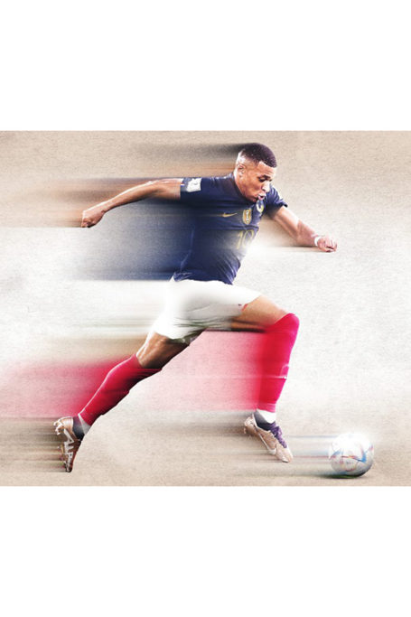 Footballer Mbappé running with a ball