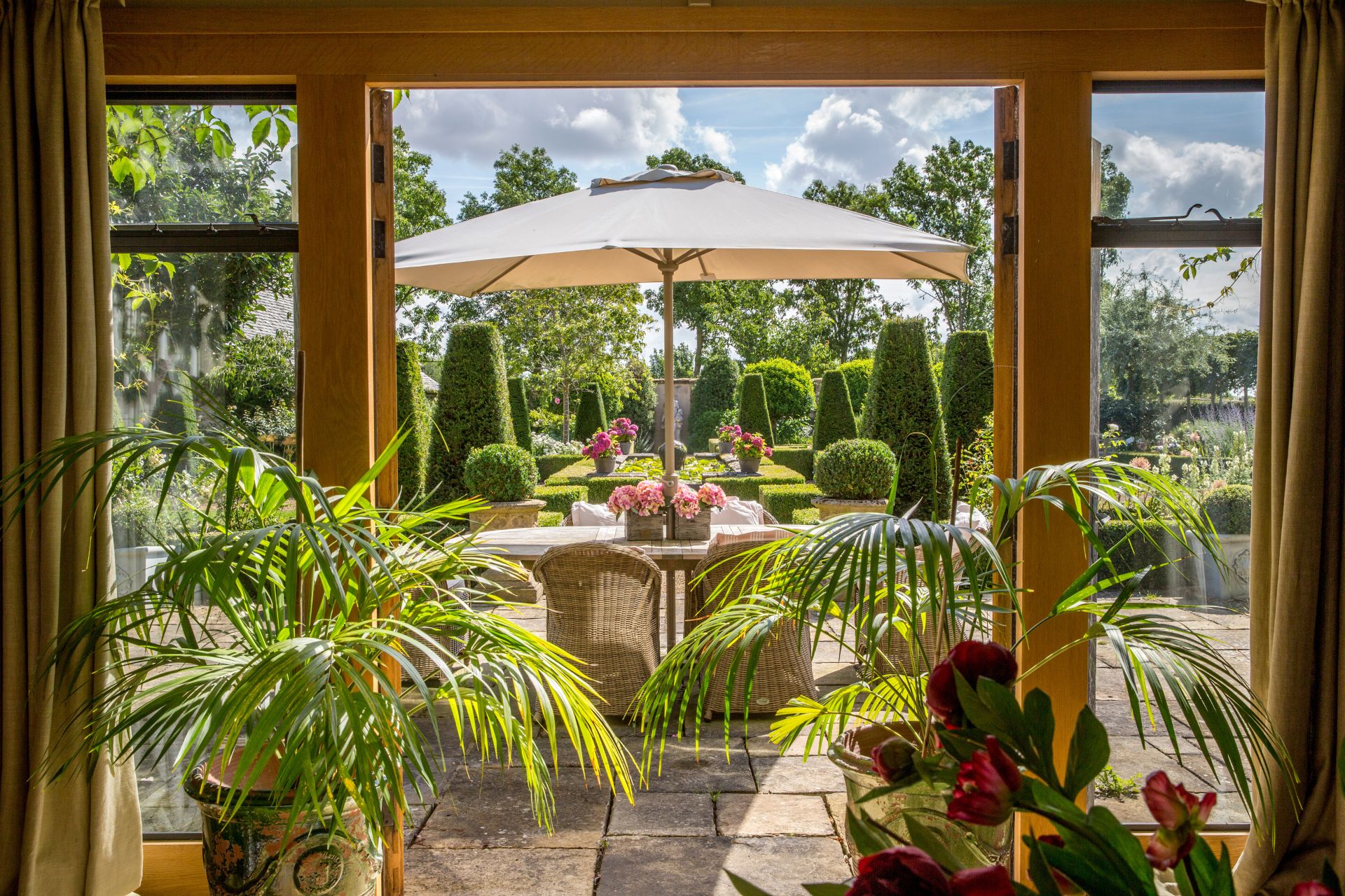 Garden courtyard with dining area and parasol