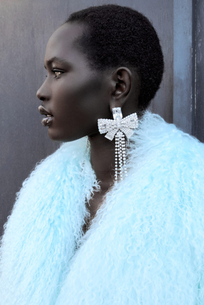 Woman wearing Self-Portrait jewellery