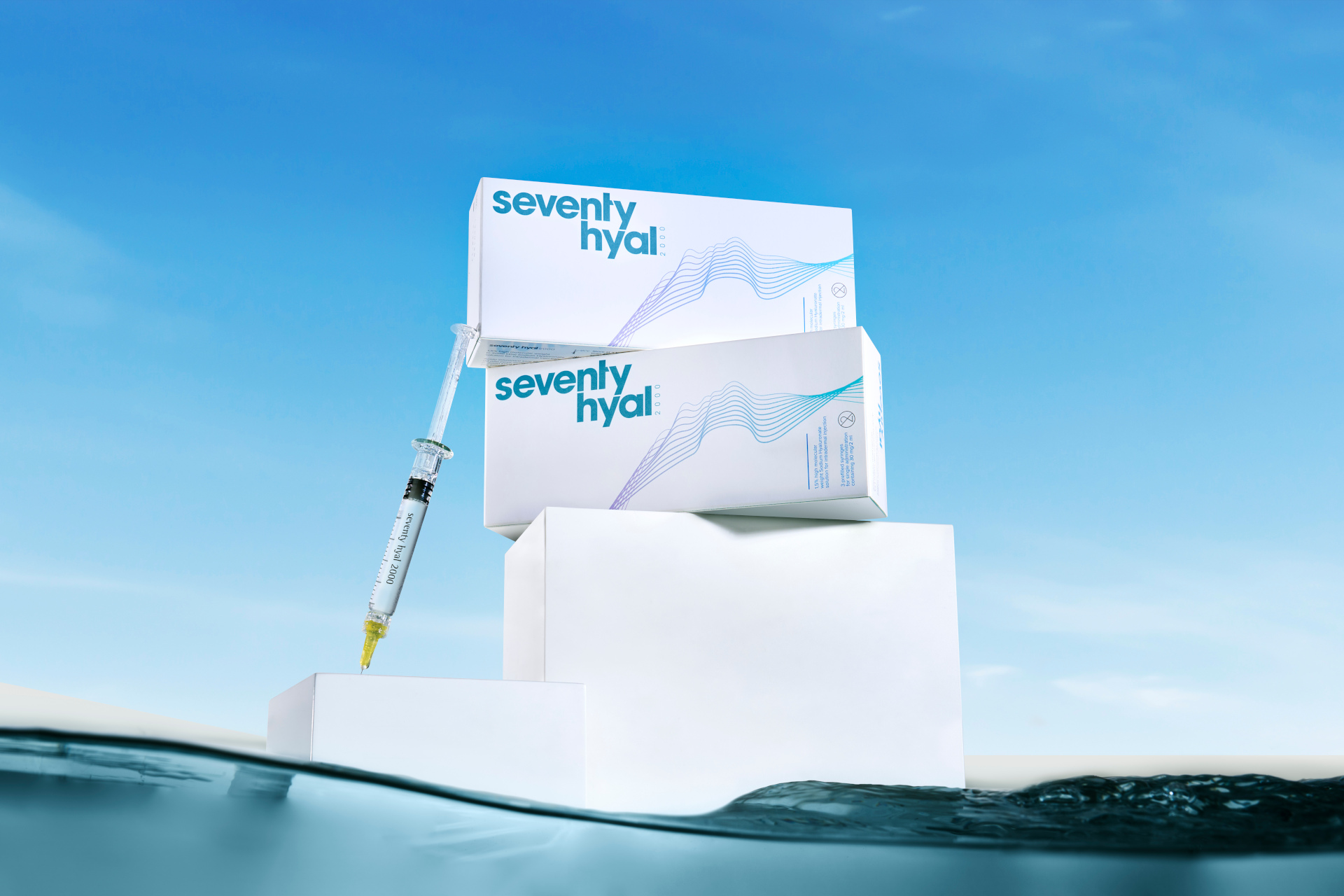White boxes stacked above water on blue sky background