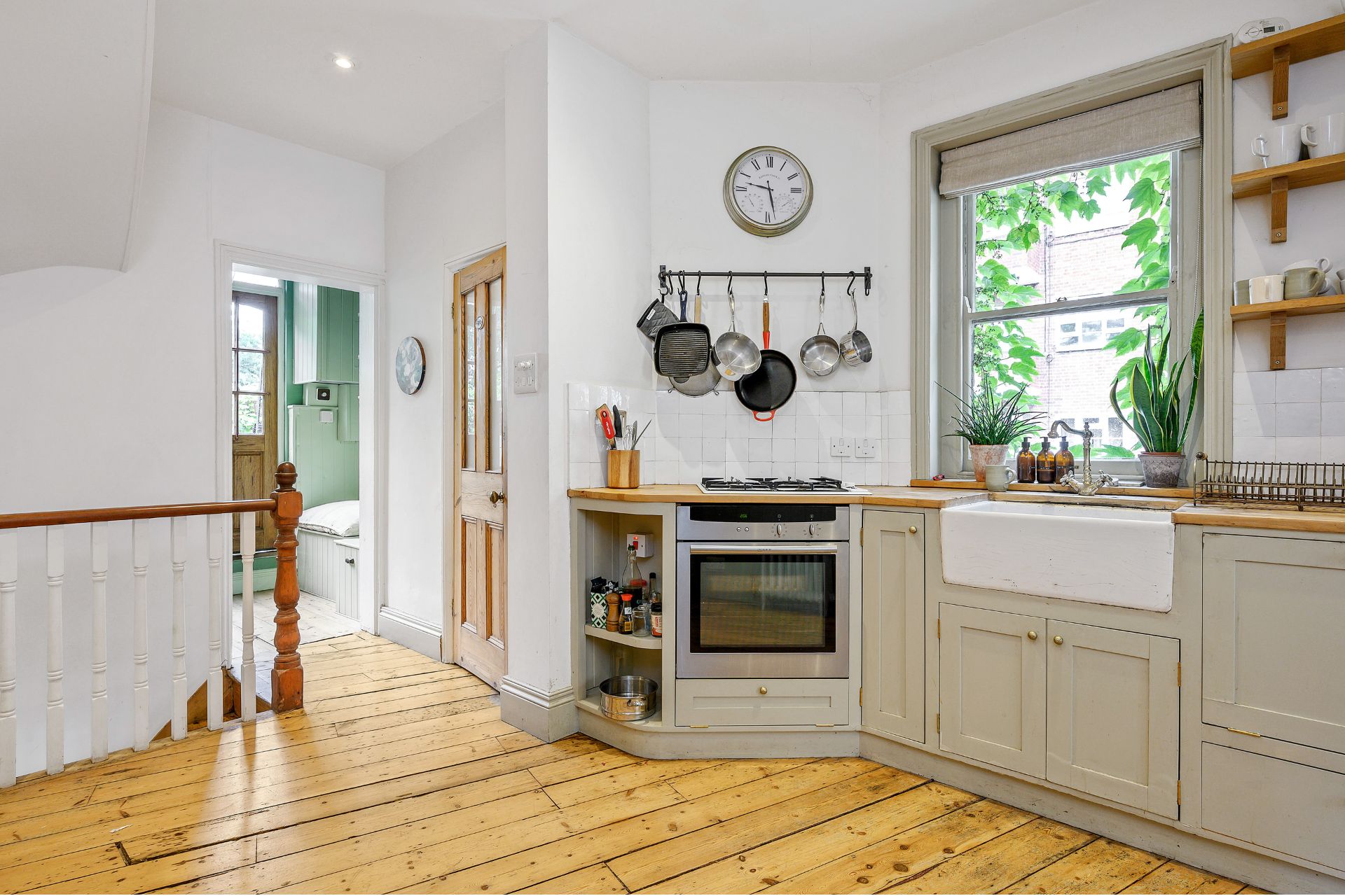 Kitchen with taupe cabinets and a butler's sink