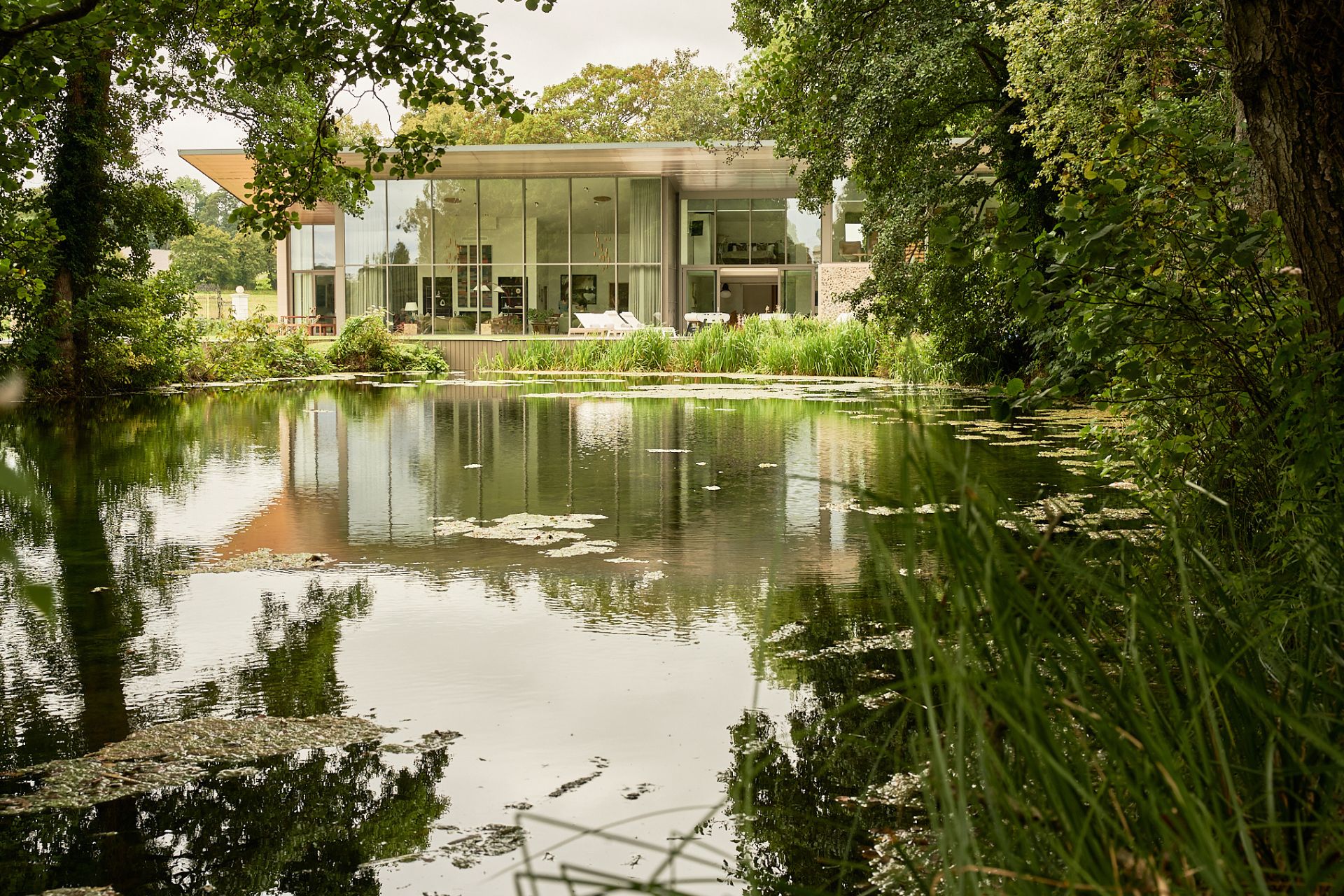 Aerial view of contemporary house with lake