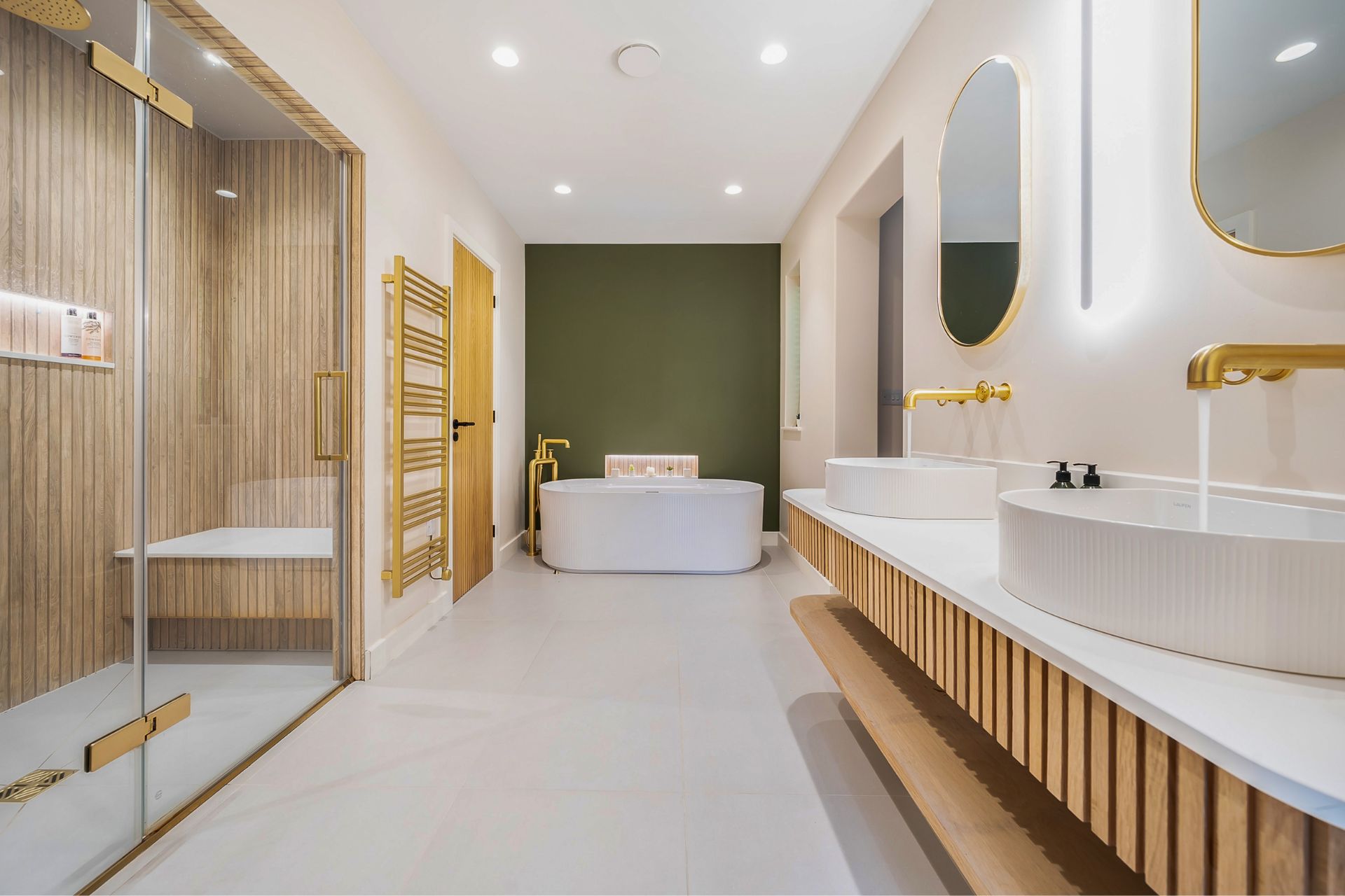 Large modern bathroom with sauna and free-standing bathtub.