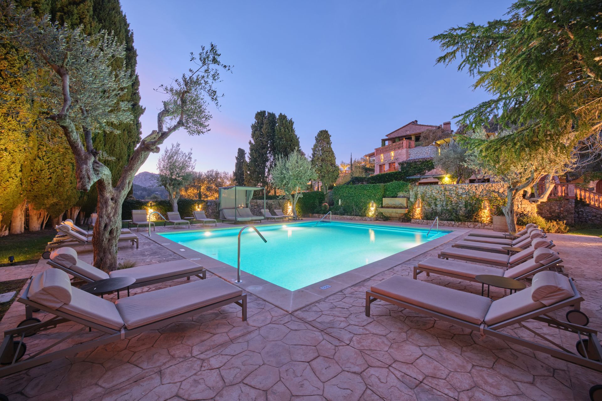 Outdoor hotel pool photographed at dusk