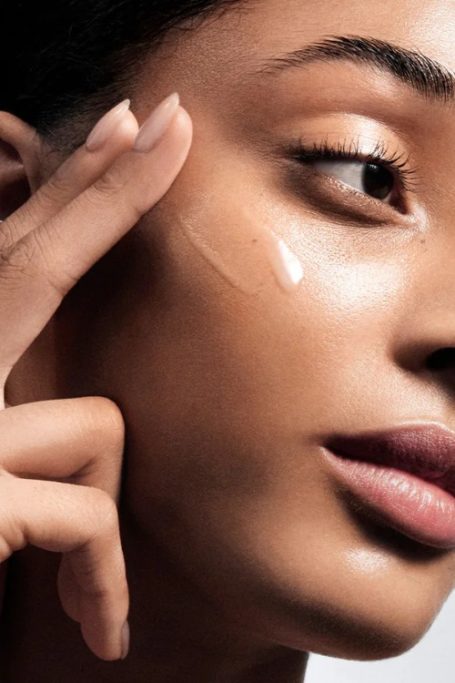 Woman applying serum