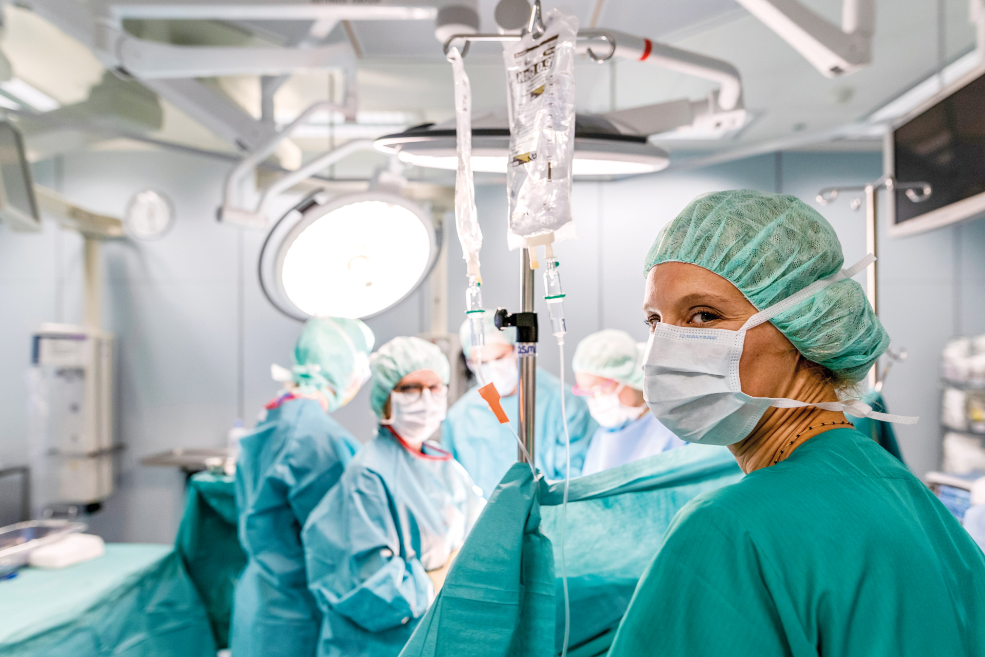 People in scrubs in operating room