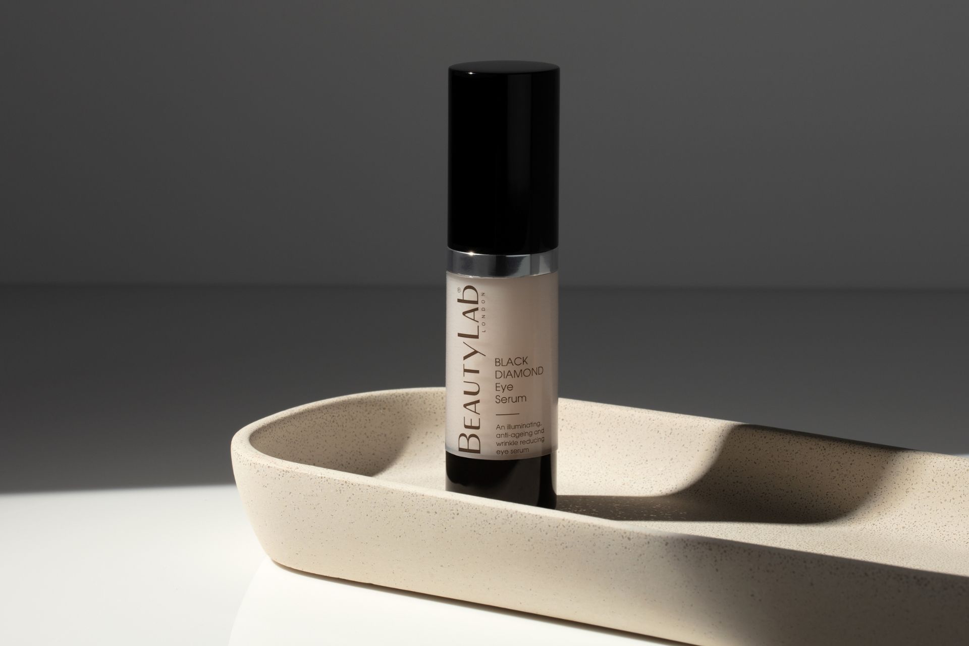 BeautyLab eye serum in a clear bottle with a black lid.