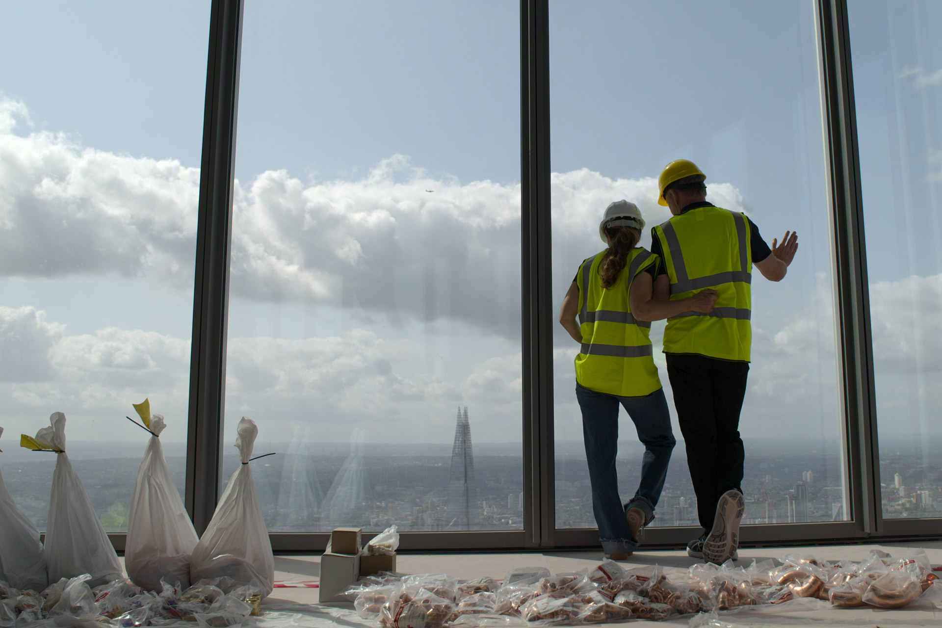 Gordon and Tana Ramsay looking out the window at 22 Bishopsgate