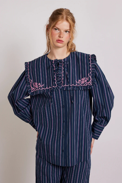 Woman in striped bedcore blouse