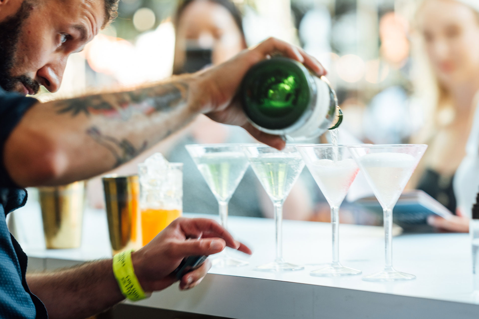 Bartender pouring champagne cocktails