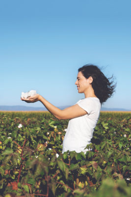Woman is holding natural cotton interiors fabrics