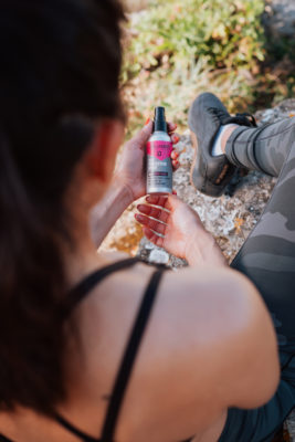 Over-shoulder view of women looking at suncare product