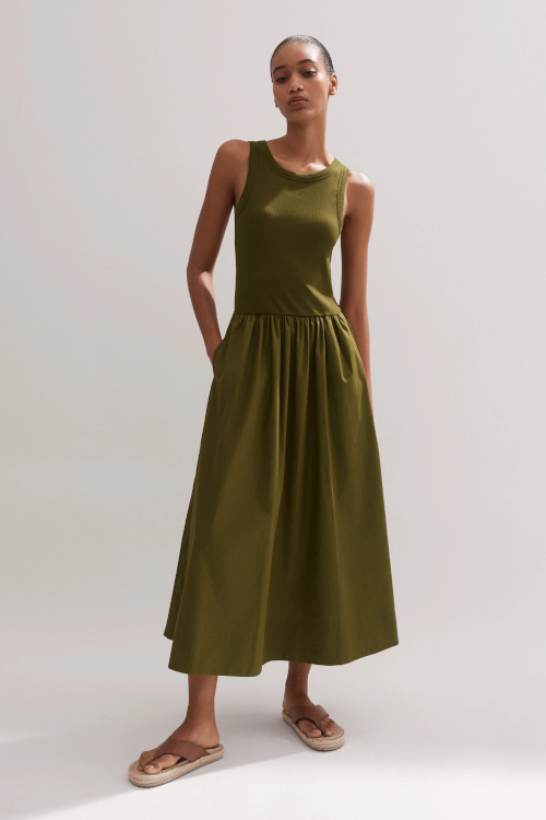Woman in olive dress