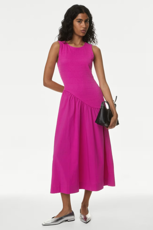Woman in pink fit and flare dress