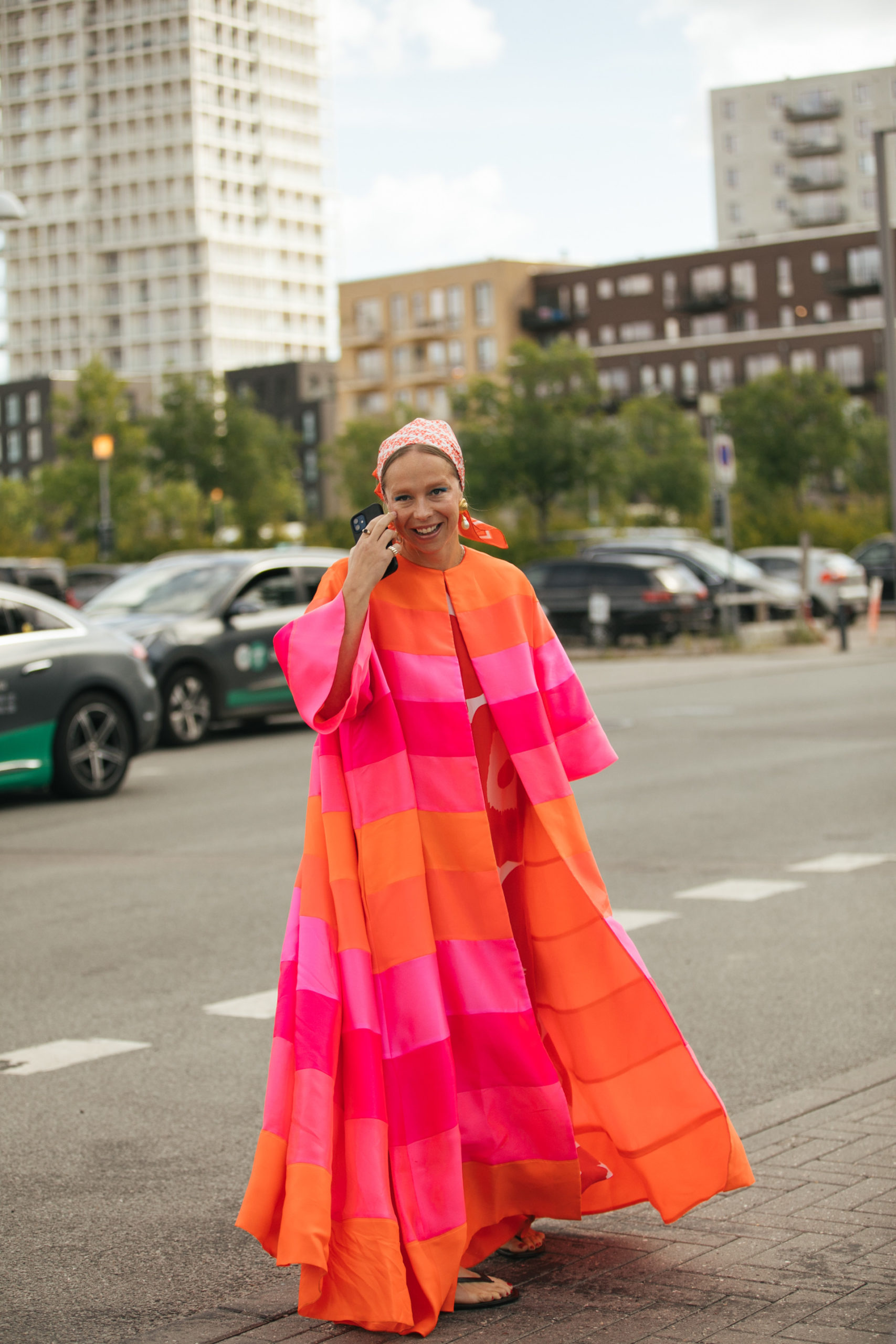 Woman in pink dress and scarf