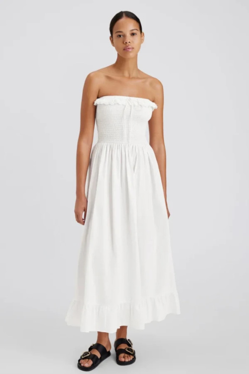 Woman in white fit and flare dress