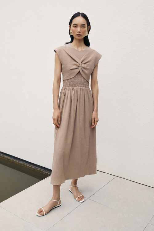 Woman in beige gown