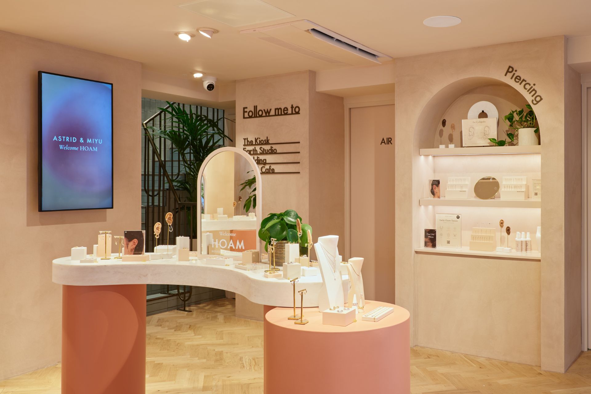 Astrid & Miyu piercing station with pink display table