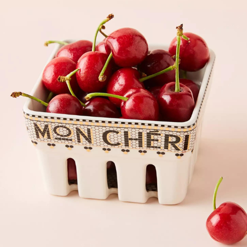 White ceramic dish with cherries