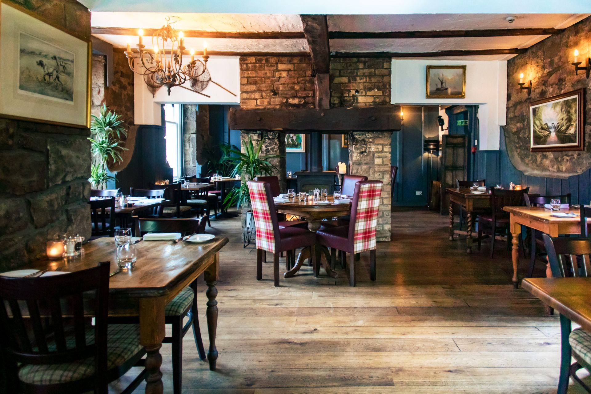 Cosy restaurant with wooden floors, exposed brick and wooden beams