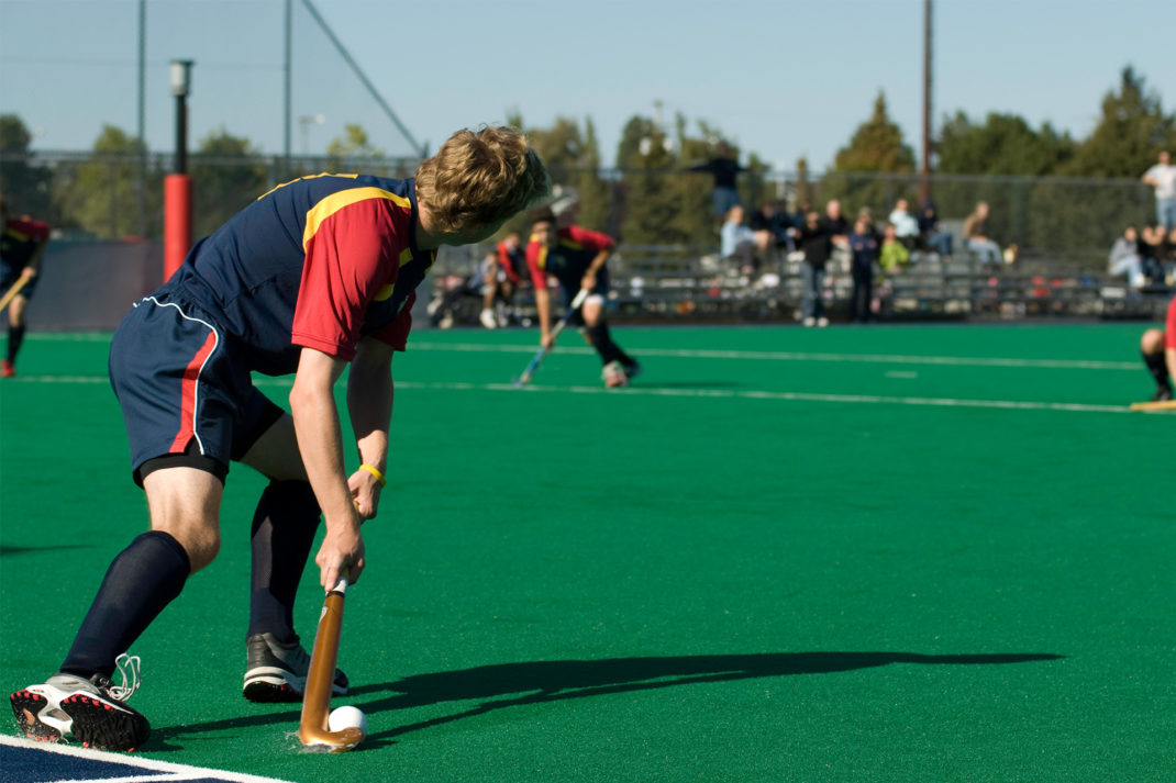 man plays hockey