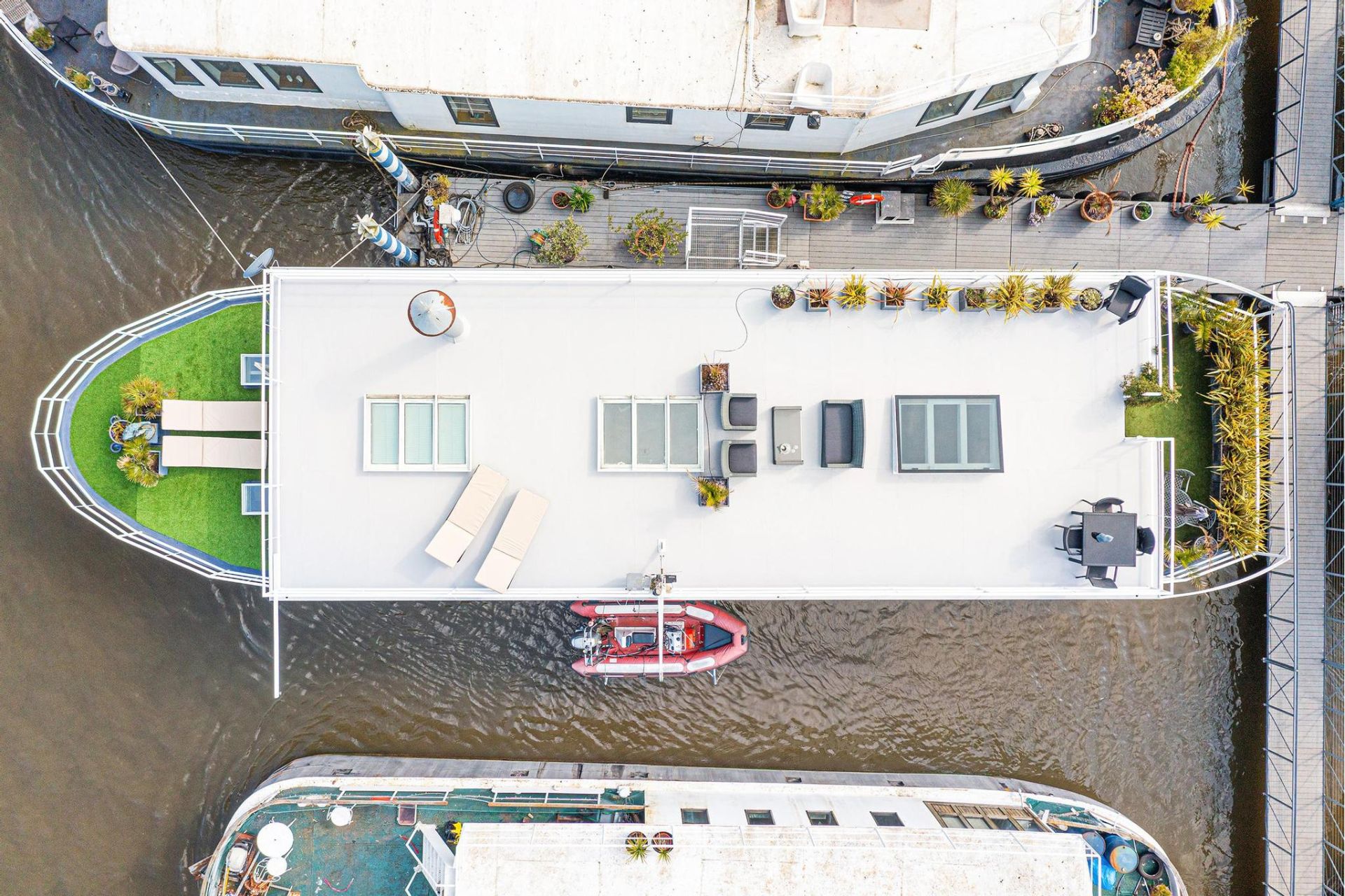 Aerial view of a houseboat with a sun deck