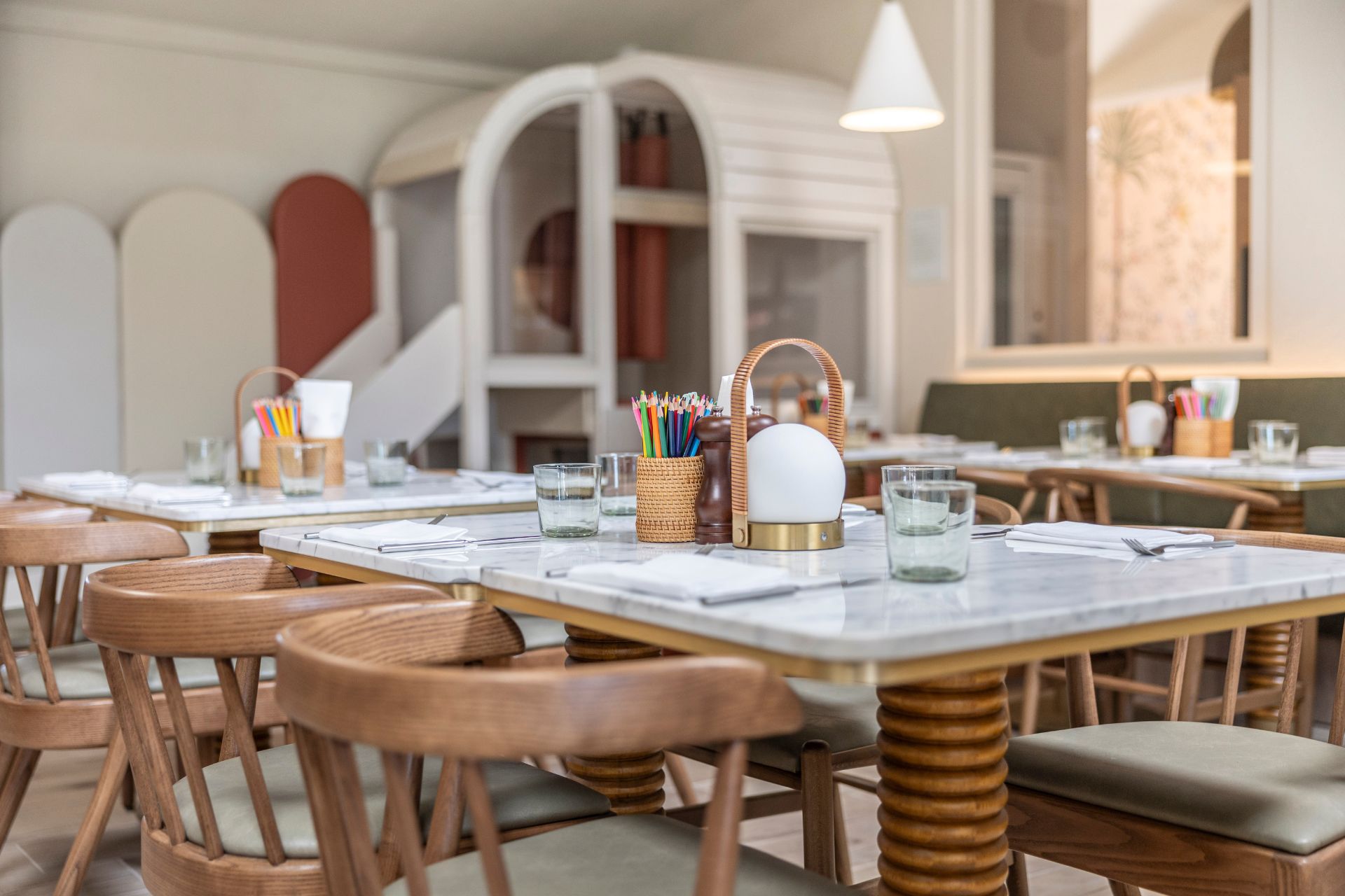 Wooden tables with marble tabletops and wooden pencil pots