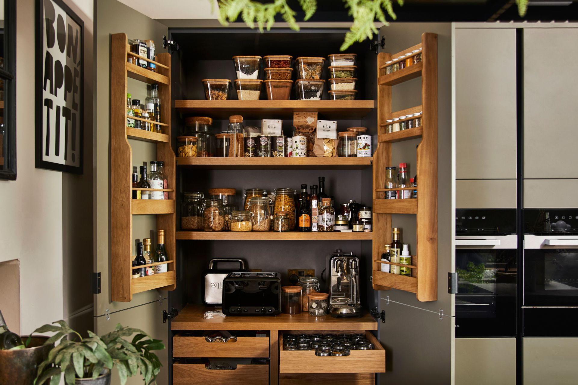 Open wooden pantry with door storage and drawers