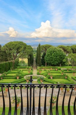 Balcony overlooking garden with landscaped hedges