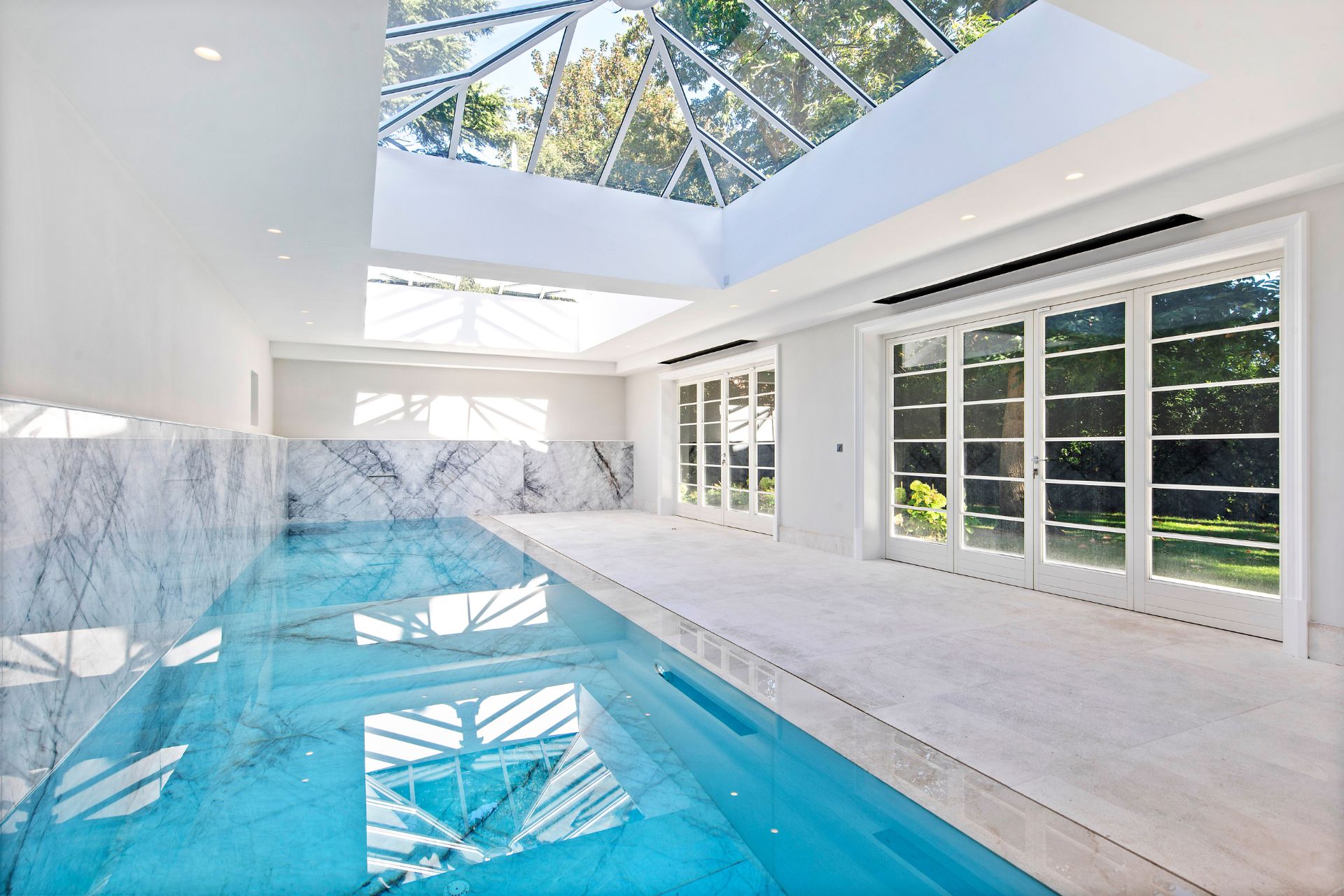 Marble-clad indoor swimming pool