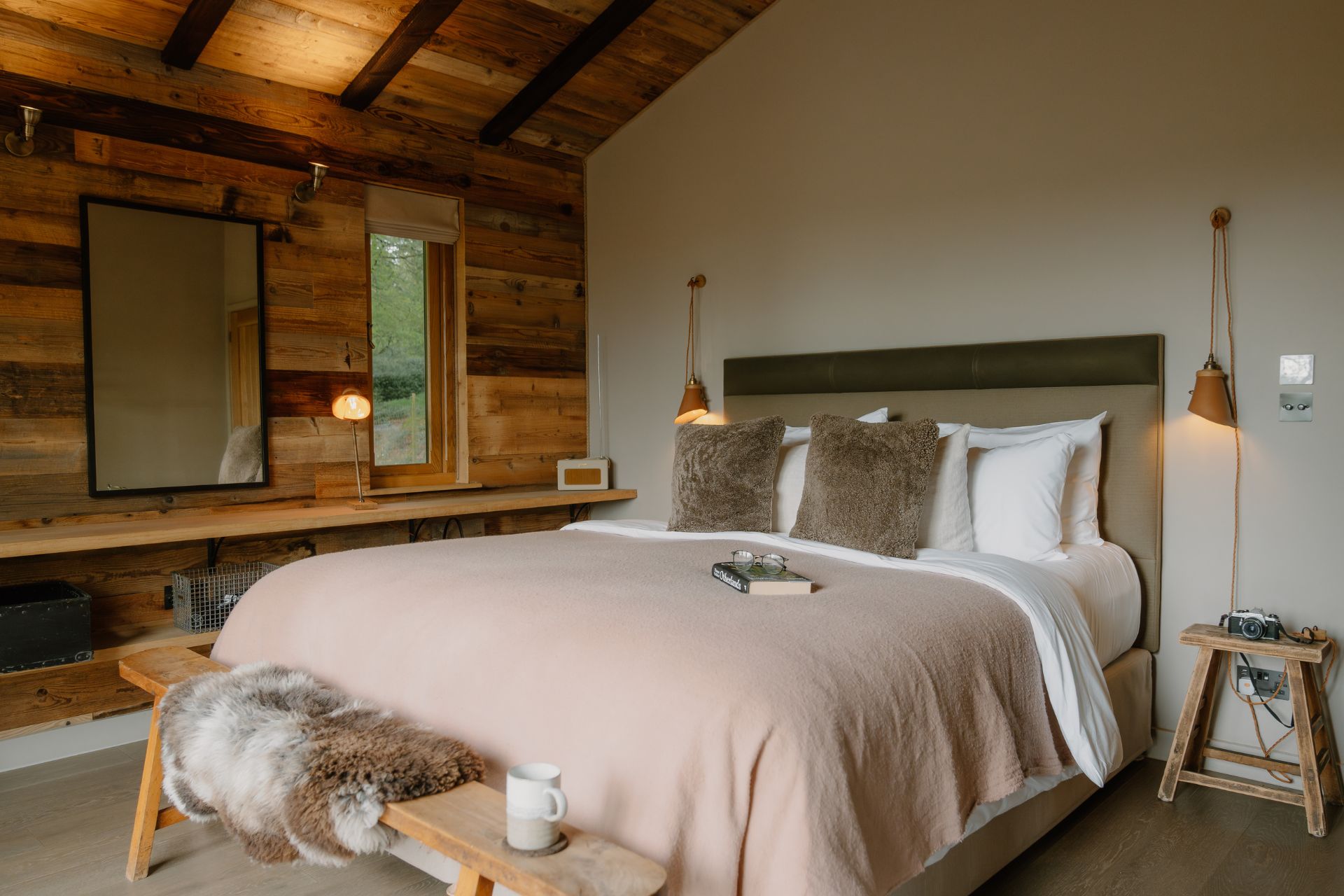 Treehouse bedroom with taupe bedspread
