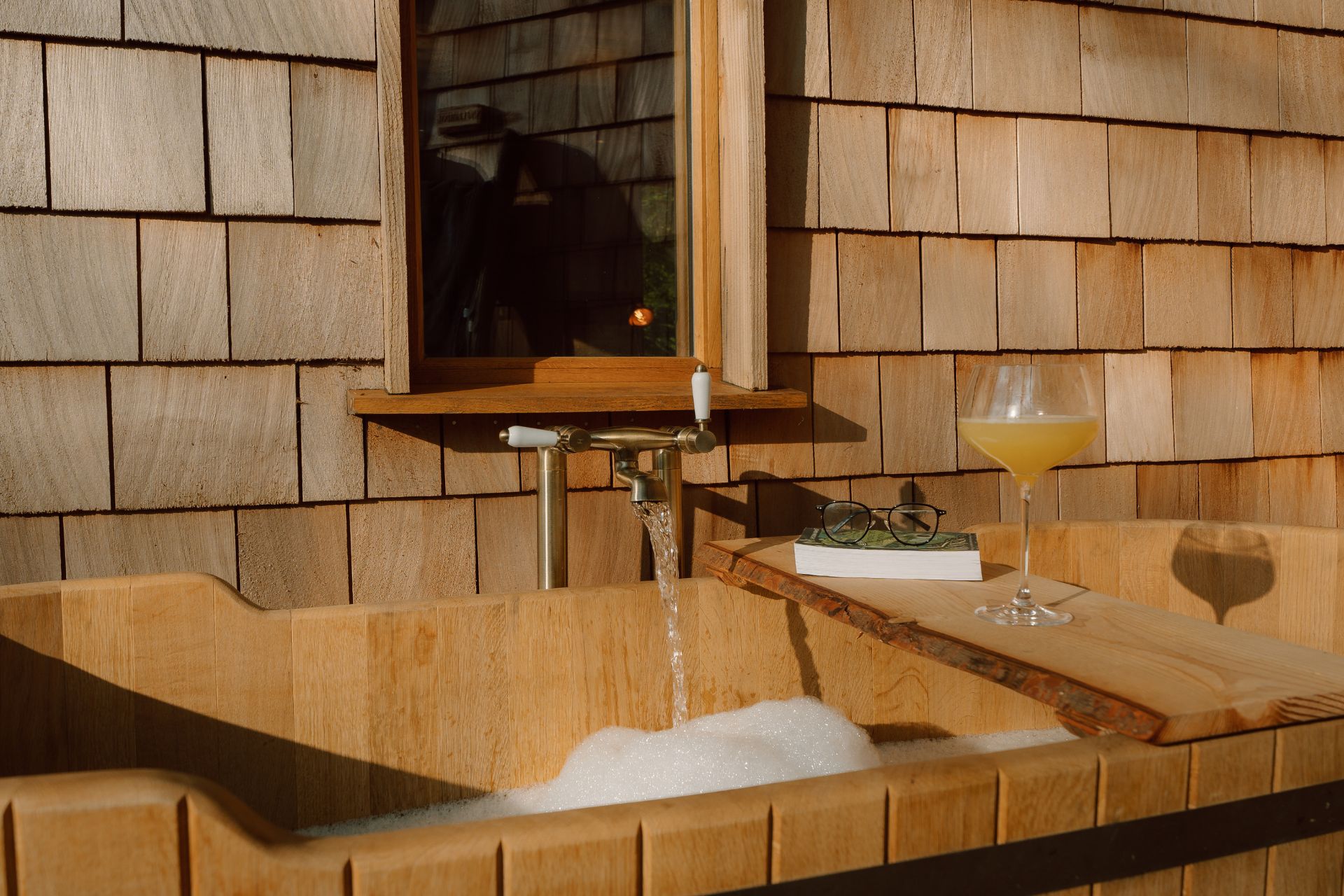 Outdoor bath with wooden bath tray