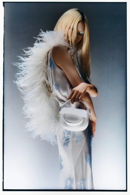 Woman in feather boa and wedding dress