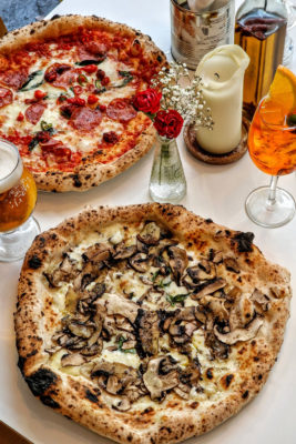 Two pizzas on a table