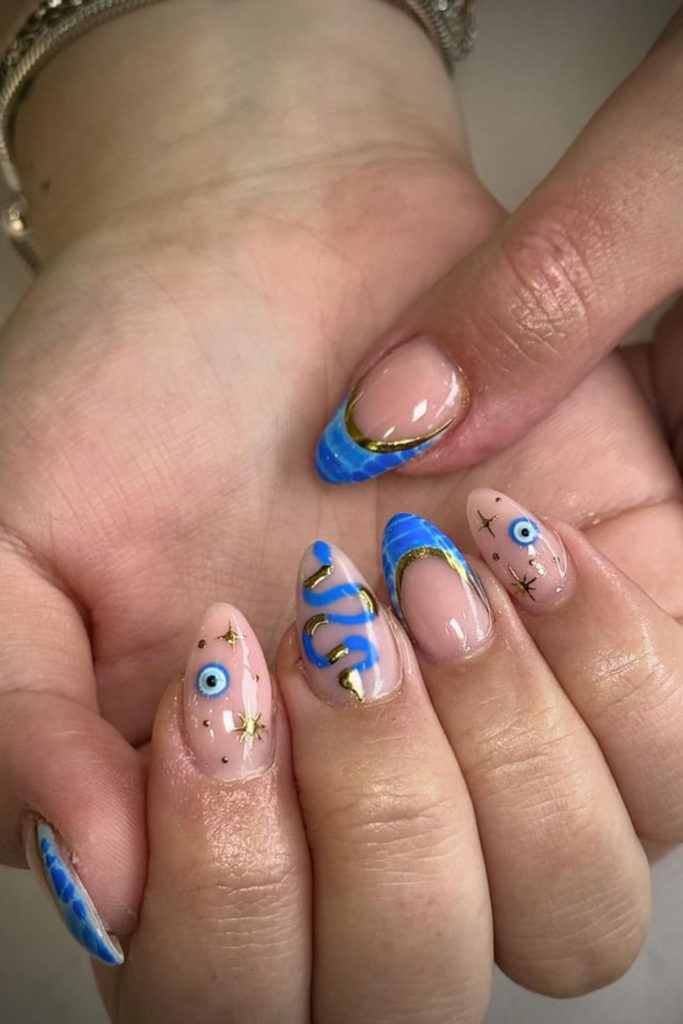 Close up of hands with Greek goddess nails